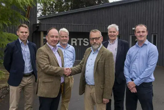 Group of men shaking hands